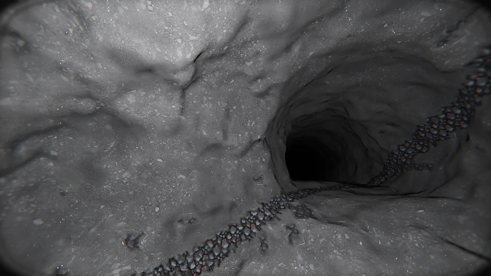 A tunnel cut into grey moon rock, an ore vein running along its floor into the dark